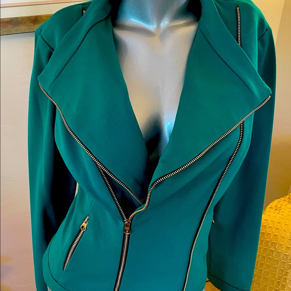 Carries Emerald Green Jacket.